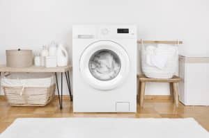 modern washing machine and laundry baskets